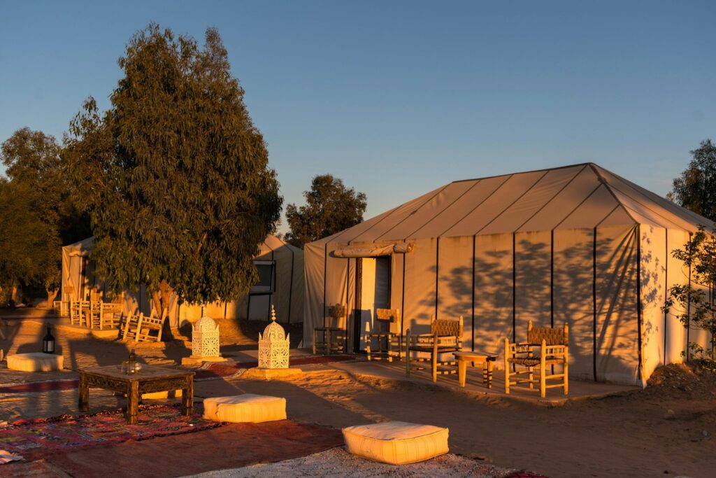 a tent set up in the middle of a field